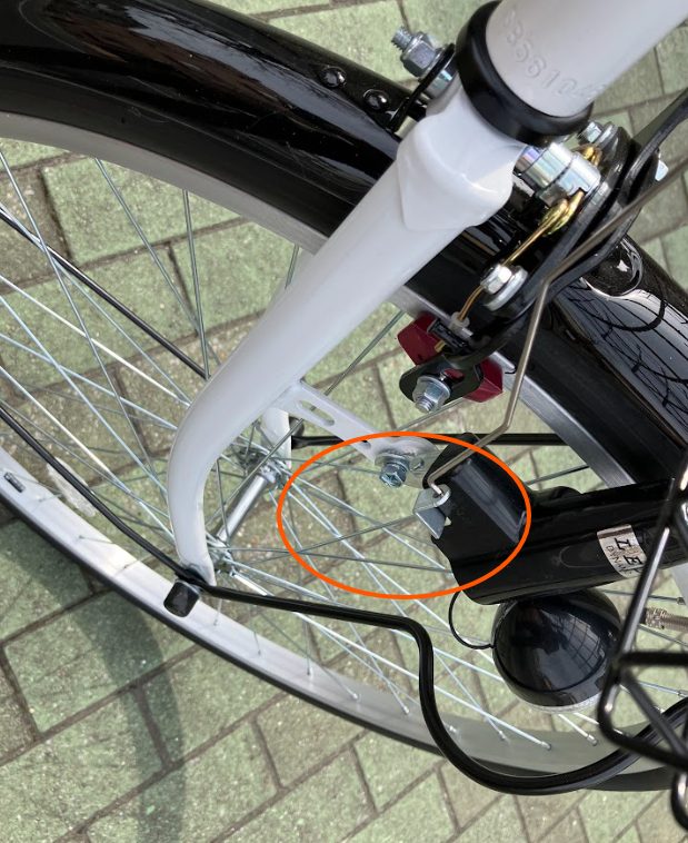 Dynamo light lever near the front wheel